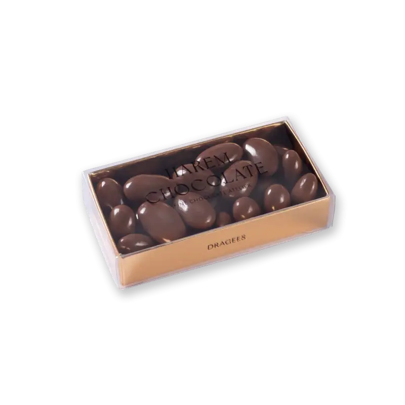 Luxurious Turkish chocolate almonds in a clear box with gold accents, perfect for gift-giving or indulging, available for fast shipping from Turkey.
