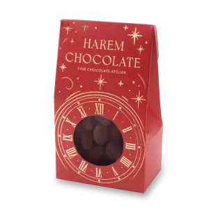 Delicious Harem Chocolate with a festive red packaging featuring a clock design and star motifs, perfect for gifting or celebrating special occasions.