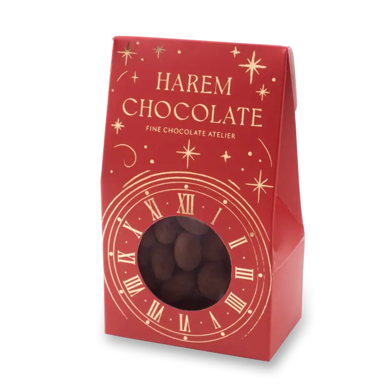 Delicious Harem Chocolate with a festive red packaging featuring a clock design and gold accents, perfect for gifting or holiday celebrations, with fast shipping from Turkey.