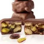 Creamy Turkish chocolate-covered pistachio candies, gourmet treats with rich, smooth chocolate coating and crunchy pistachio center. Perfect for gifting or indulging.