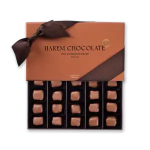 Soft brown box with a satin ribbon tied in a bow, featuring "Harem Chocolate" branding and elegant packaging.