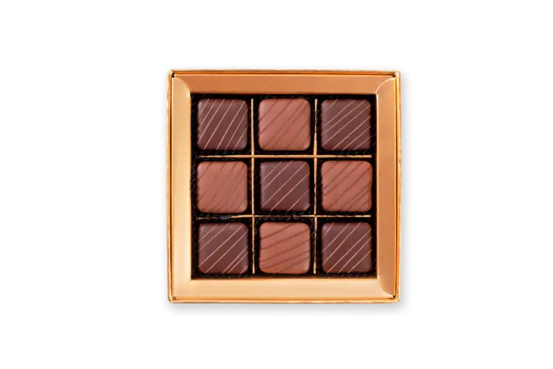 Luxurious assorted Turkish chocolates in a gold box, perfect for gifting, featuring a rich creamy flavor and elegant presentation. Ideal for celebrations and special occasions.