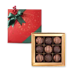 1. Assorted luxury chocolate truffles in a gold box with festive holiday packaging, perfect for gift-giving and celebrations.