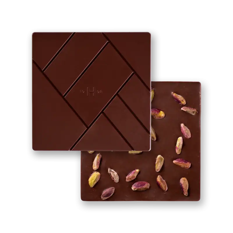 1. Luxurious dark chocolate bar with pistachio nuts, featuring a sleek, geometric design, perfect for gifting or indulgence.