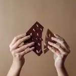 Rich dark chocolate bars with colorful pistachio nuts, handmade and artisanal. Perfect for gifting or indulging in a sweet treat.