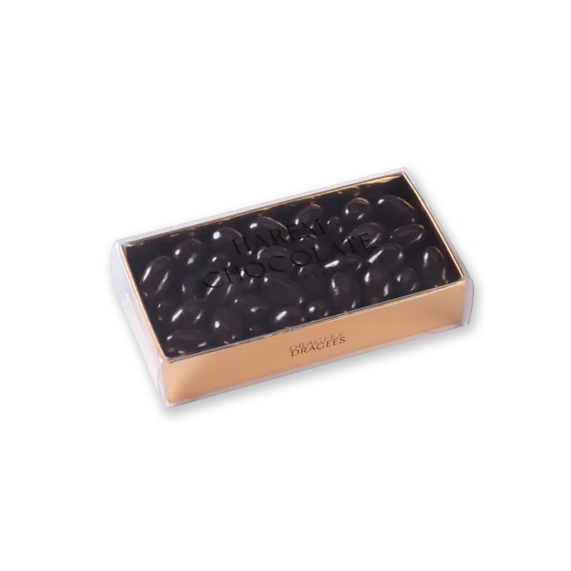 Dark chocolate-covered almonds in a transparent box labeled "Harem Chocolate" by Brages Bragees. Perfect for gifting or enjoying a luxurious treat from Turkey.