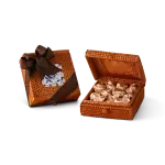 Miniature woven basket gift box with a dark brown ribbon and a decorative tag, filled with wrapped Turkish candies. Perfect for gifting or souvenirs.
