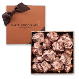 Luxurious box of handmade Harem Chocolate wrapped in elegant pink foil, perfect for gifting or indulging, offers rich Turkish chocolate flavors with fast shipping from Turkey.