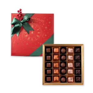 Luxurious box of assorted chocolates with a festive holiday gift box featuring a clock and green ribbon, perfect for celebrating Christmas and New Year with fast shipping from Turkey.