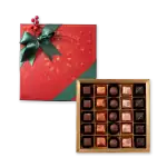 Delicious assortment of chocolates in a festive holiday gift box, perfect for celebrations.