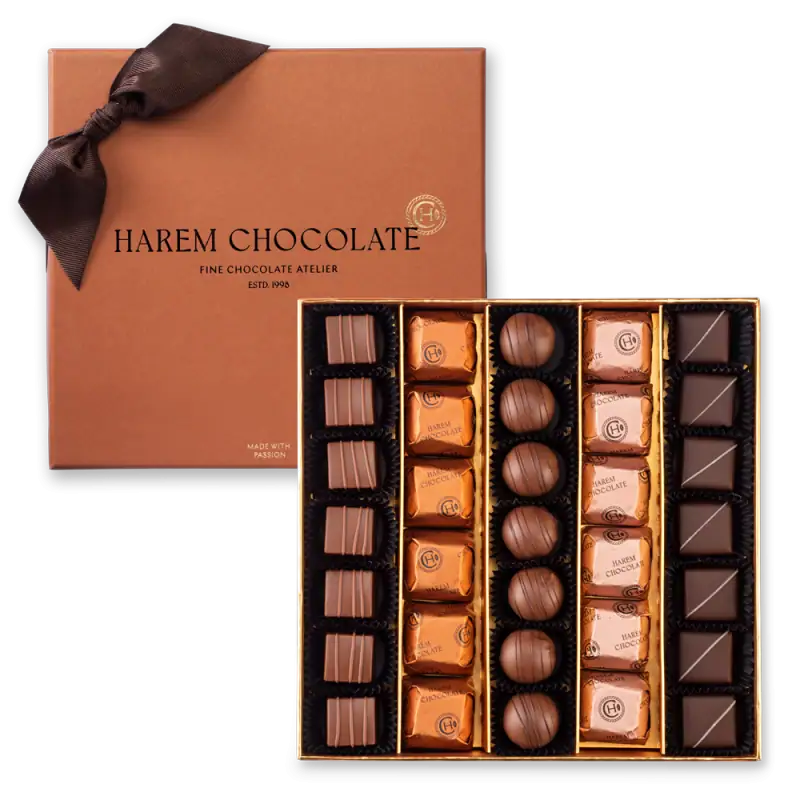 Luxurious box of assorted Harem Chocolate truffles and pralines, perfect gift for chocolate lovers, with elegant packaging and fast shipping from Turkey.