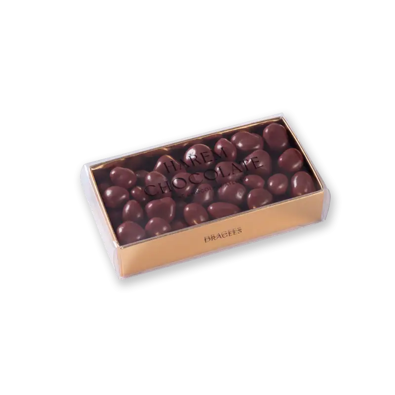 Delicious dark chocolate-covered braced almonds in a cream-colored box with a clear lid from Shop of Turkey. Perfect for gifting or indulging yourself.