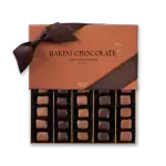 Luxurious Harem Chocolate gift box with assorted premium chocolates, wrapped with a satin ribbon, perfect for special occasions, offering fast shipping from Turkey.