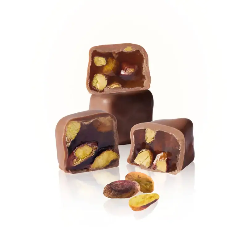 Rich Turkish chocolate candies filled with pistachios and nuts, showcasing smooth milk chocolate coating and delicious nut center. Perfect for gifting or indulging.