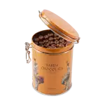 Smooth milk chocolates in an orange tin container, featuring traditional Turkish artwork, perfect for gifting or indulging your sweet cravings from Turkey.