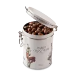 Rich milk chocolate covered almonds in a stylish white tin with Turkish art illustrations, perfect for gifting or enjoying premium Turkish chocolate sweets.