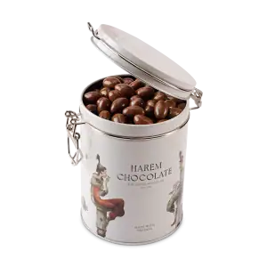 Rich milk chocolate covered almonds in a stylish white tin with Turkish art illustrations, perfect for gifting or enjoying premium Turkish chocolate sweets.