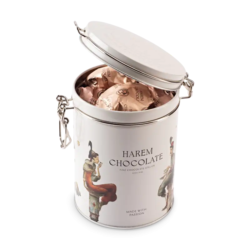 Individually wrapped Harem Chocolate inside a stylish white decorative tin with artistic women illustrations, perfect for gifting or indulging in Turkish fine chocolates.