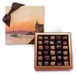 Luxurious Turkish chocolate box with assorted handcrafted chocolates, beautifully packaged with Istanbul's skyline artwork, perfect for gifts or indulging in authentic flavors from Turkey.
