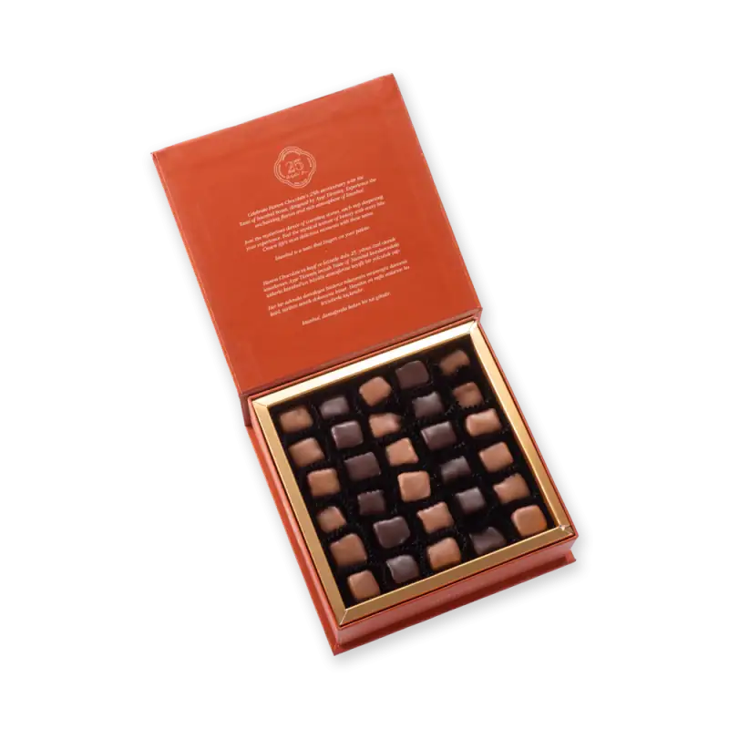 Assorted luxury Turkish chocolates in a rich orange gift box with gold accents, perfect for gifting or indulging. Fast shipping from Turkey available at Shop of Turkey.