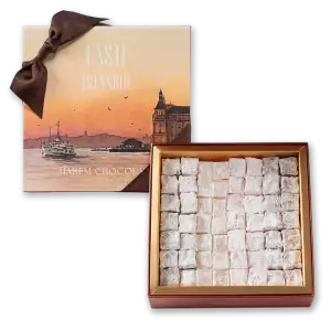 Delicious Turkish delight candies in a box, featuring powdered sugar coating, perfect for gifting or enjoying traditional Turkish sweets.