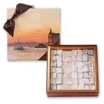 1. Assorted Turkish delight candies in a luxurious box with a sunset Istanbul scene and a ribbon-tied gift package.