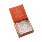 Delicious Turkish delight cube candies in a gift box, coated with powdered sugar, perfect for gifting or enjoying authentic Turkish flavors.