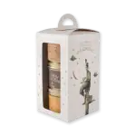 1. Elegant gift set of Turkish flavored spreads and jams in pastel-colored jars, presented in a whimsical storytelling box with charming circus-themed artwork.