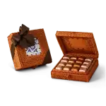 Deluxe woven gift box with chocolates, tied with a brown ribbon, perfect for Turkish sweets or gifts.