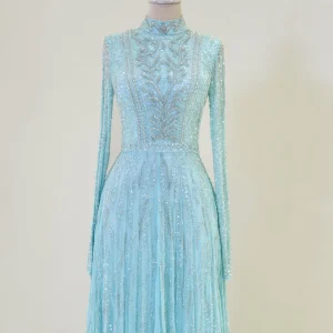 Elegant turquoise evening gown with intricate beadwork and embroidery, perfect for special occasions and formal events. Made with high-quality fabric, offering a luxurious look and comfortable fit.