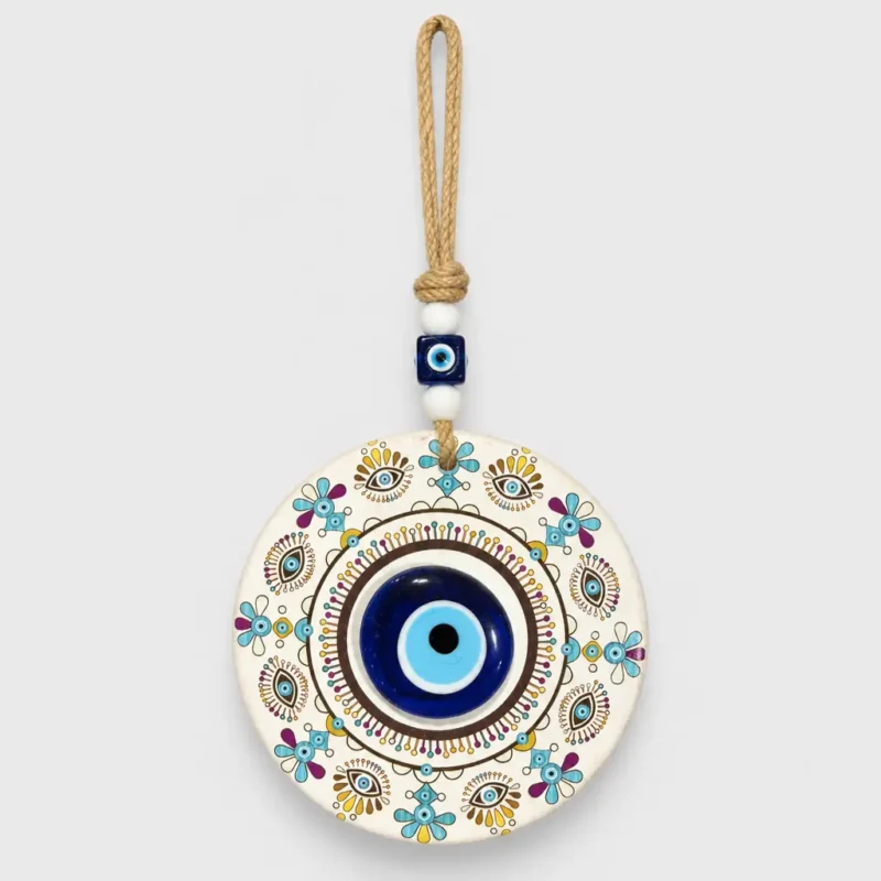 Turkish evil eye wall hanging mandala disc held in hand front view