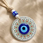 Turkish evil eye wall hanging cobalt glass centre on patterned ceramic disc