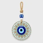 Turkish evil eye wall hanging ceramic tulip disc held in palm
