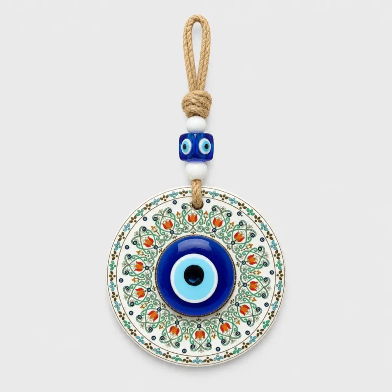 Turkish evil eye wall hanging ceramic tulip disc held in palm