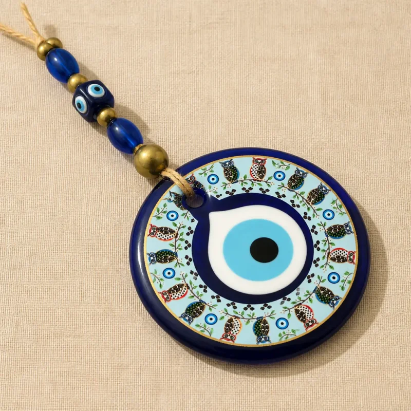 turkish-evil-eye-wall-hanging-with-owl-design-beads-premium Turkish evil eye wall hanging glass center with deep blue border and gold trim