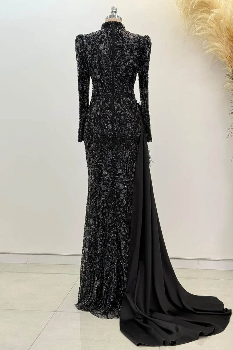 Belvette black hijab evening dress with beaded embroidery, long sleeves, high neck, and flowing train