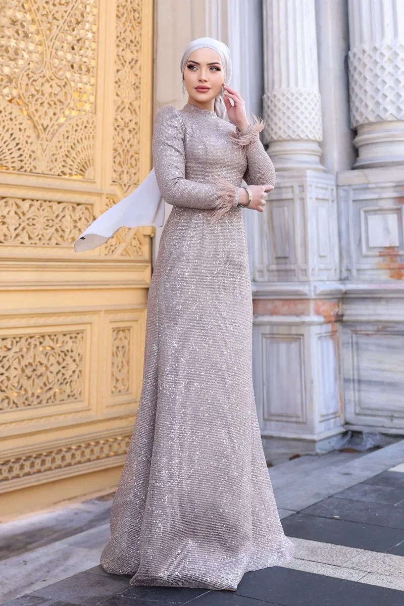Glimette hijab evening dress in champagne sequin with feather-trimmed shimmer tulle cuffs, full length
