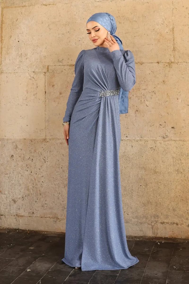 Glimmette hijab evening dress in blue with glitter fabric, stone-embellished waist, and long sleeves