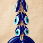 Close-up of turquoise and white eye motif on large cobalt blue nazar bead