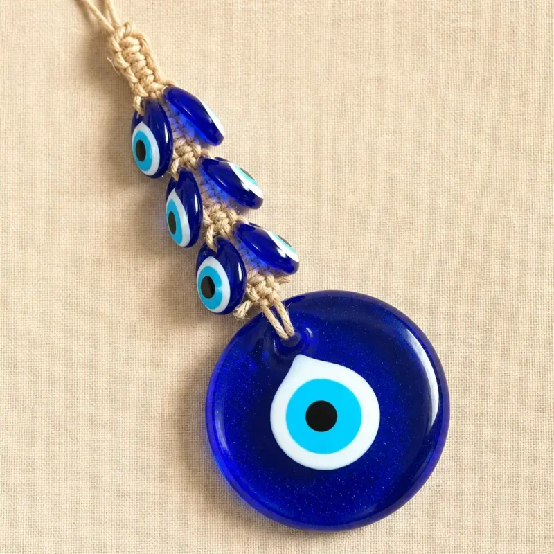 Turkish evil eye wall hanging with macrame cord and cluster of small nazar beads