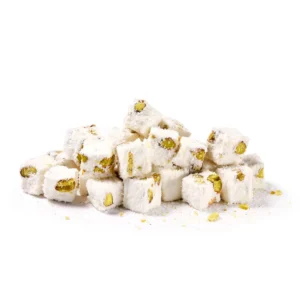 Pile of white powdered Turkish delight lokum cubes with green pistachio pieces visible inside